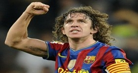 Barcelona's captain Puyol celebrates after their Spanish first division soccer match against Real Madrid in Madrid